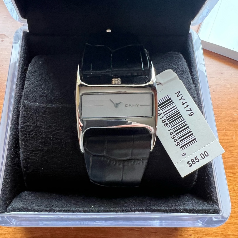 DKNY Watch  Silver Black Leather Band.  Vintage but never worn.